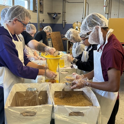 Alumni and FFA members worked together to package meals for our community.