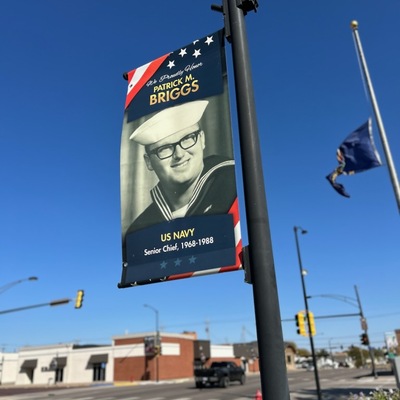 Veterans Banner showing Patrick Briggs, Lyons Veterans Fund volunteer